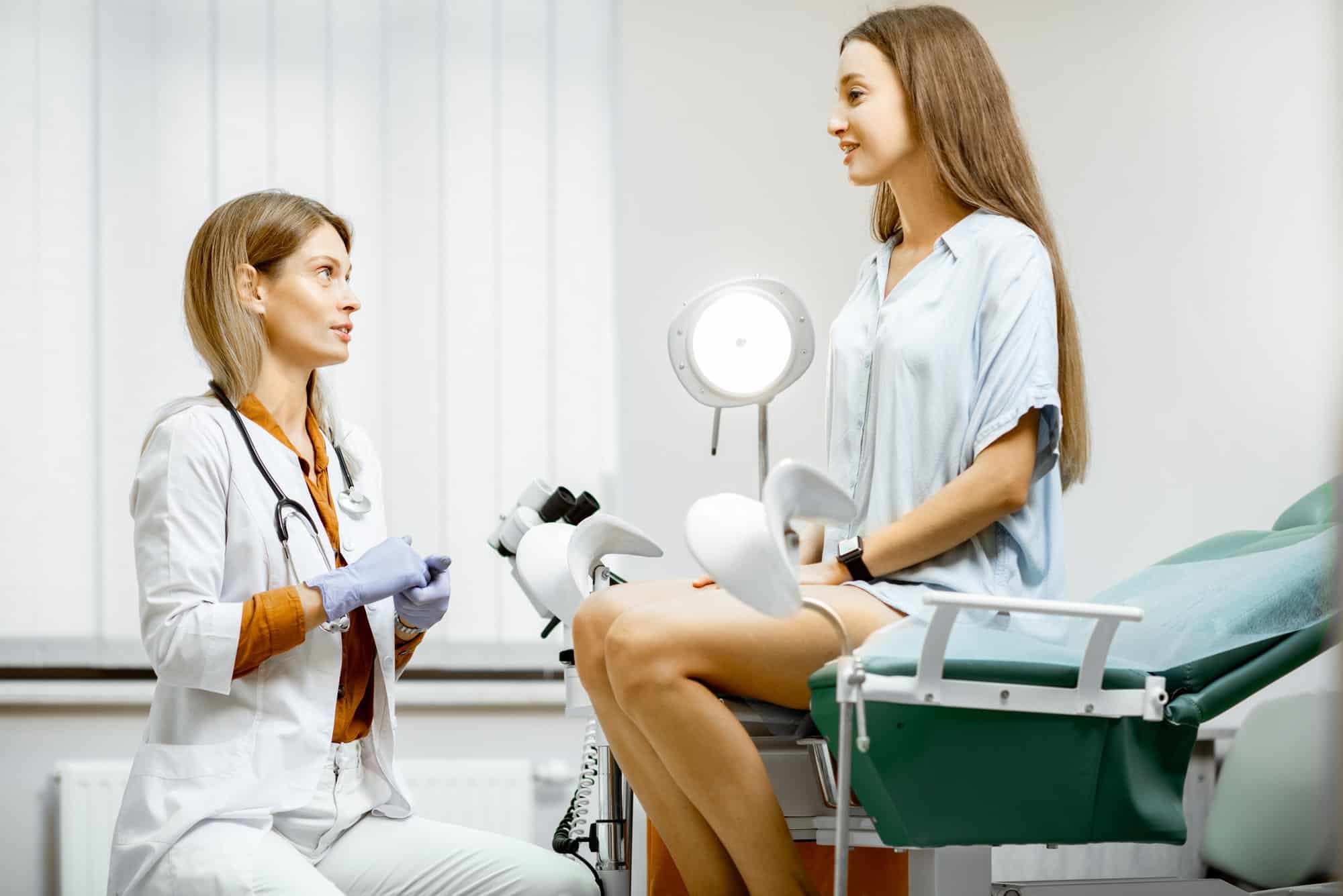 Gynecologist with patient in the office