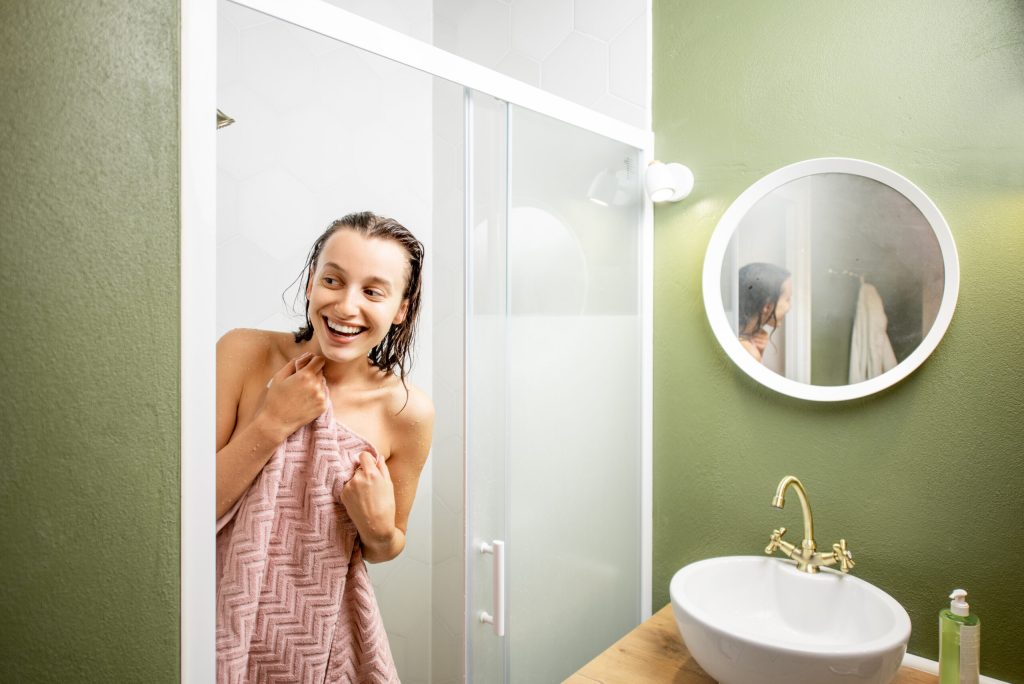 Woman after the shower in the bathroom