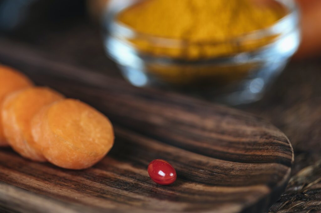 Beta Carotene Supplement Pills and Vegetables