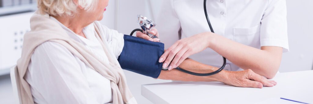 Doctor measuring blood pressure