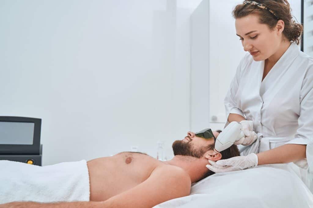 Experienced dermatologist carrying out a cosmetic procedure