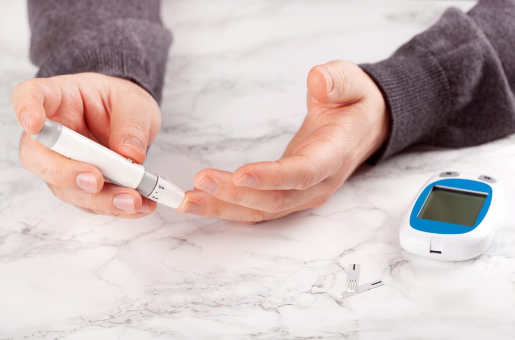 man hand blood sugar ketones level diabetes keto diet health care at home