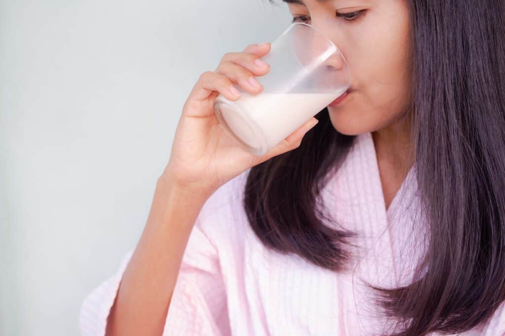 Woman drinking soimilk. hight calcium and protein food. lifestyle lady concept.